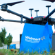 Ground-level shot of a Walmart bag being dropped off by a delivery drone